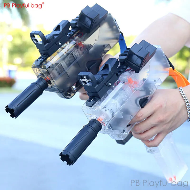 Clear toy blaster with black components held by a person outdoors
