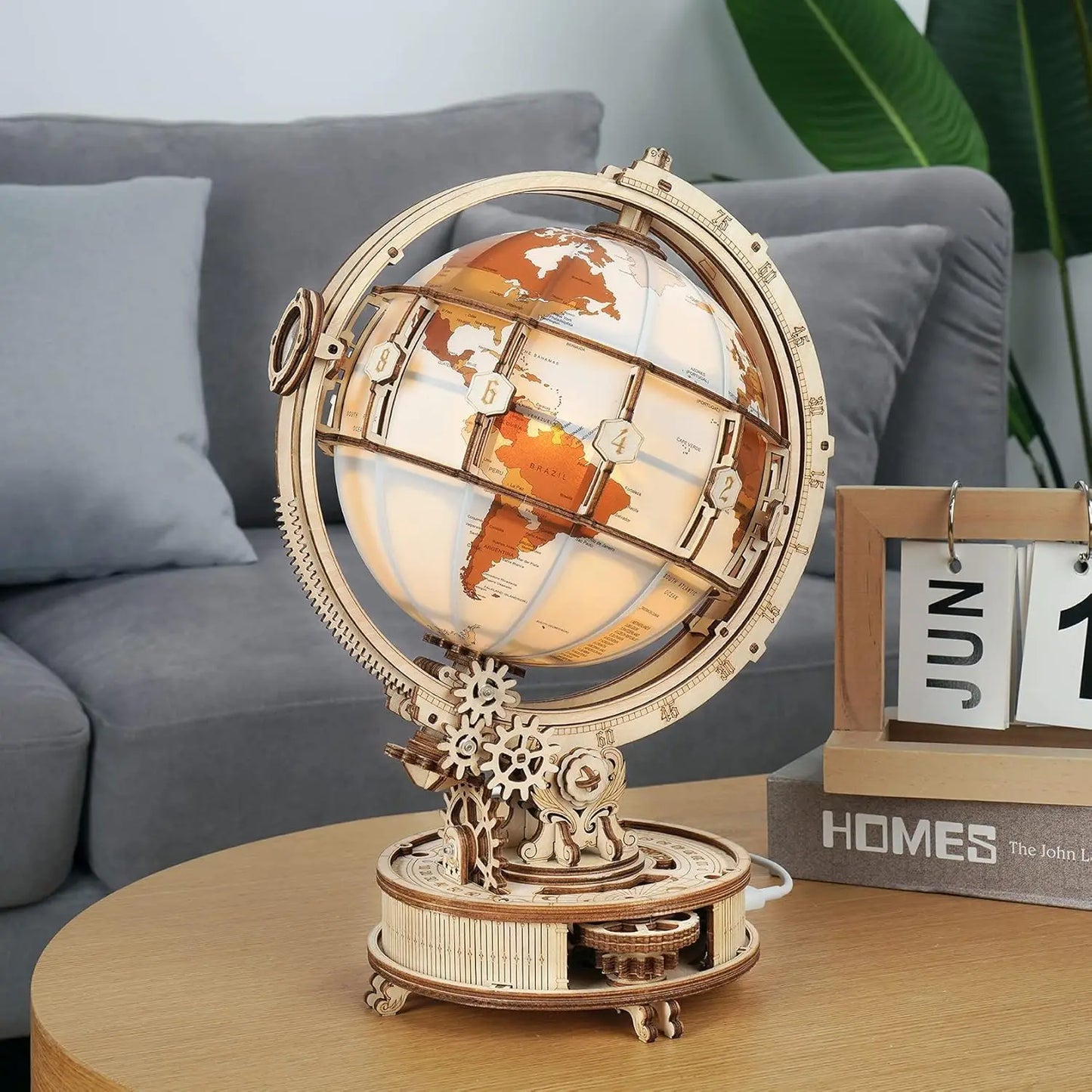 Decorative world globe with mechanical design on a wooden table