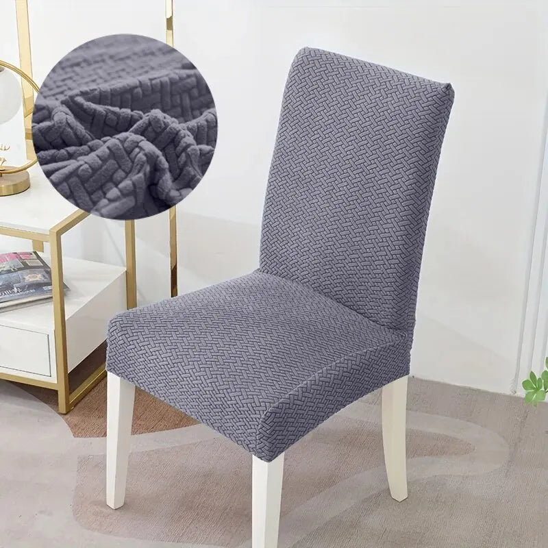 Gray chair cover with texture detail on a chair in a room setting.