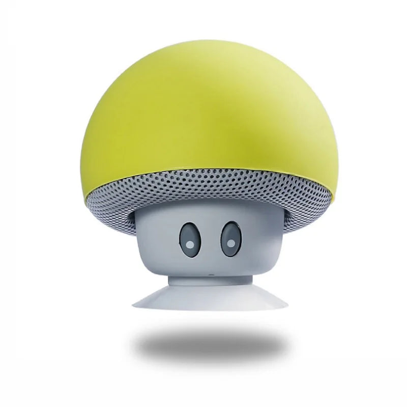 Mushroom-shaped speaker with yellow top and gray bottom on a white background