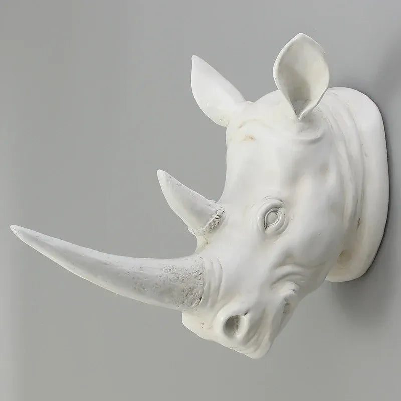 Rhino head wall sculpture displayed in a luxury hotel lobby as an eye-catching animal wall art centerpiece