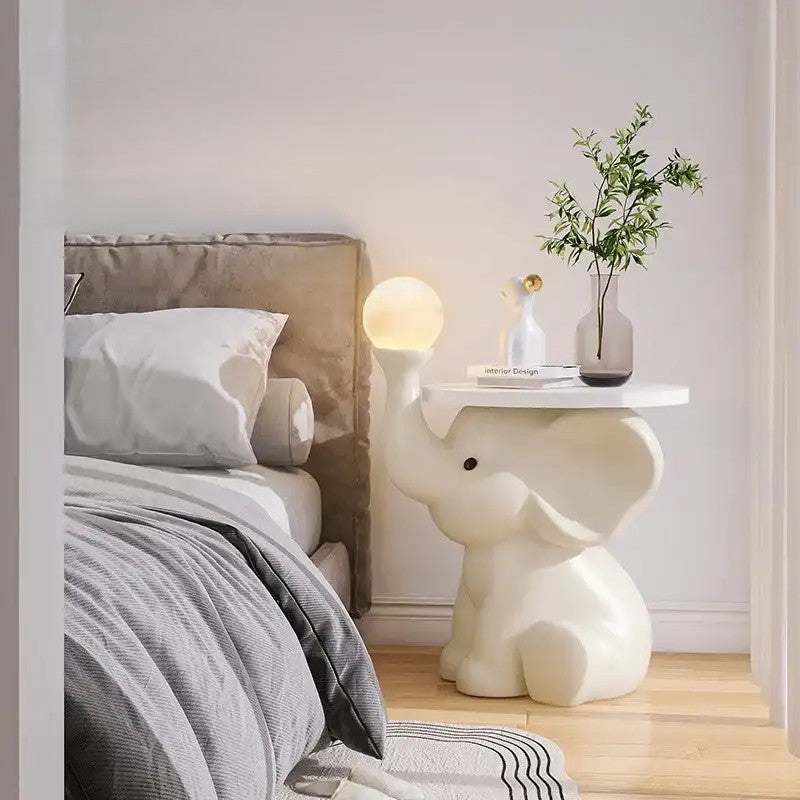 Modern bedroom with a bed, nightstand, and decorative elements.