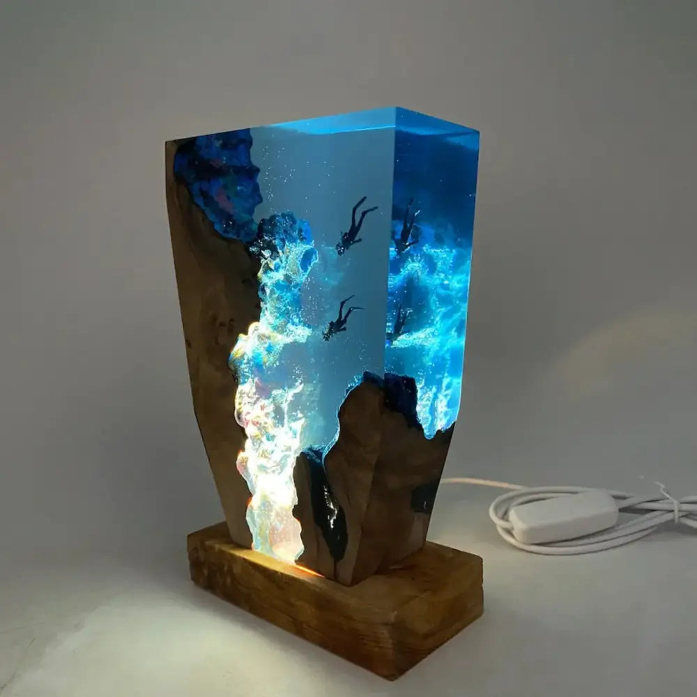 Wooden lamp with a glass container filled with colorful liquid and underwater scene on a gray background