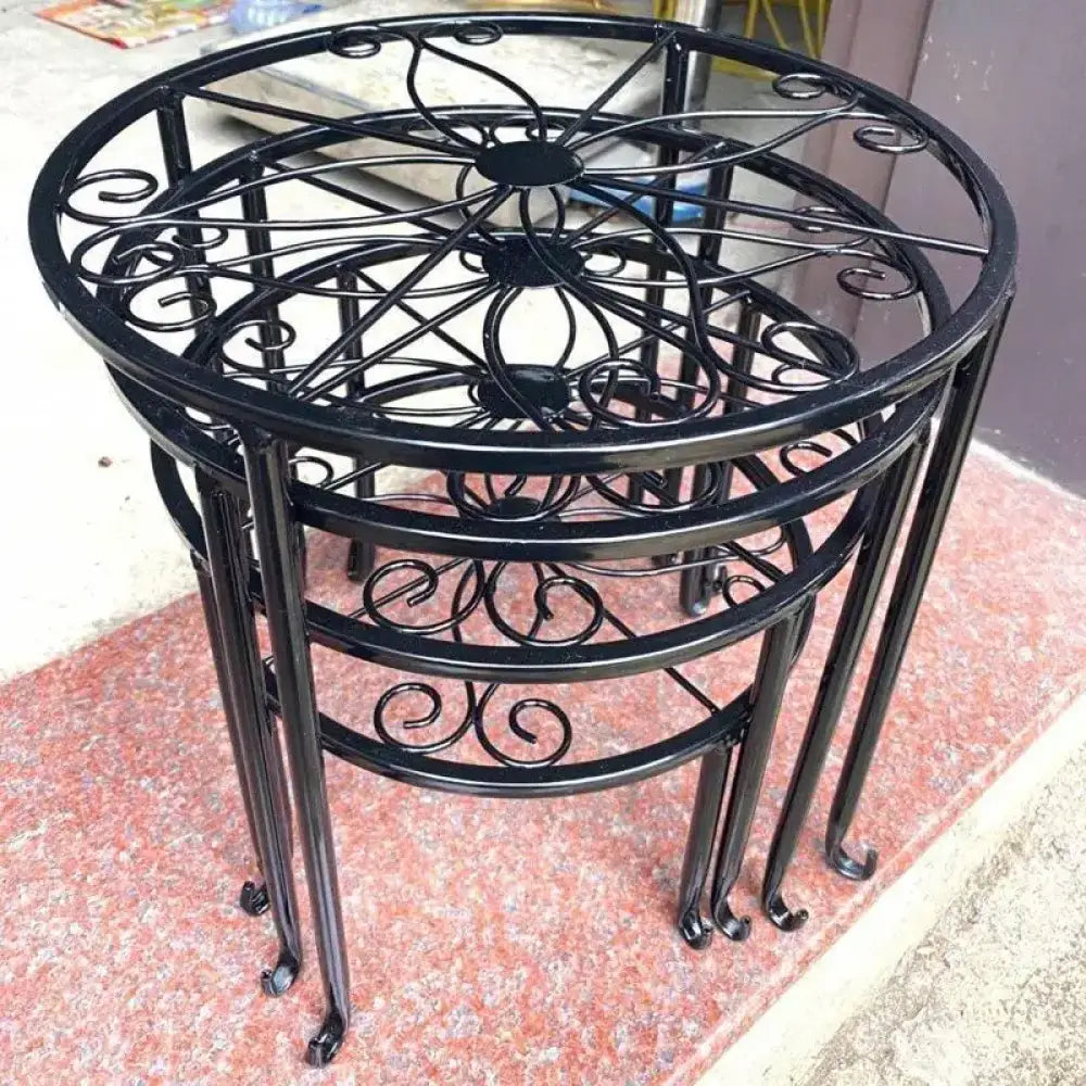 decorative metal stand in front of stone steps.