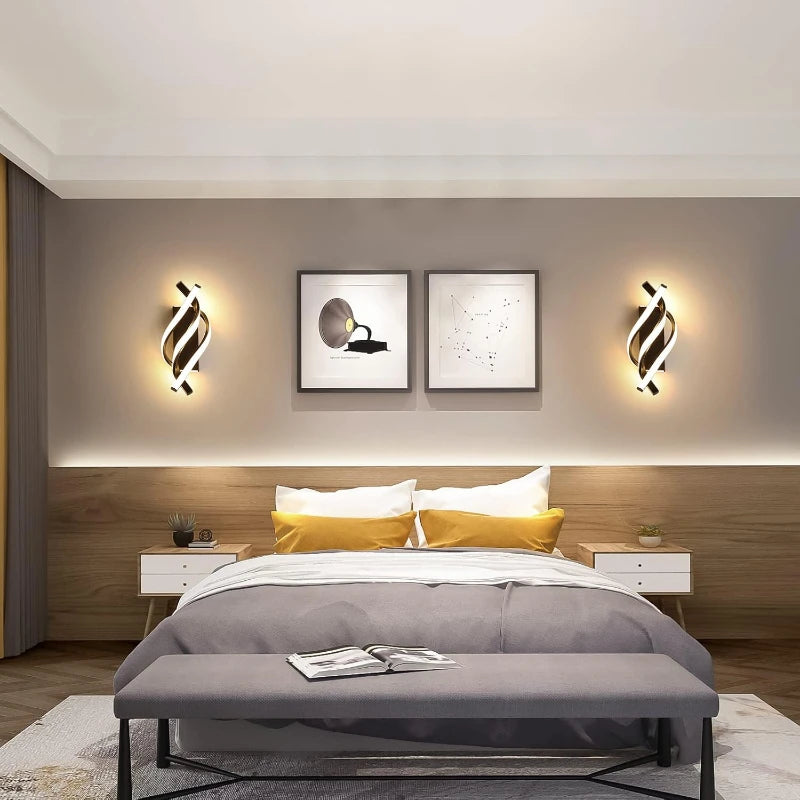 Modern bedroom with a bed, nightstands, and wall lights.
