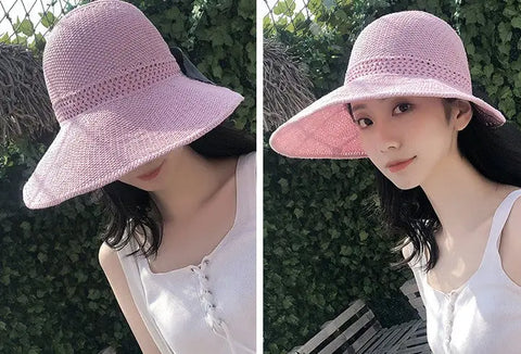 Women's foldable beach hat showing roll-up packable design and bow detail for travel