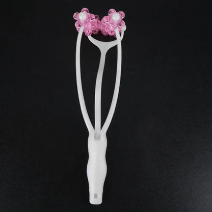 White eyelash curler with pink floral accents for face roller collagen production