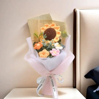 A bouquet of flowers with a book on a table