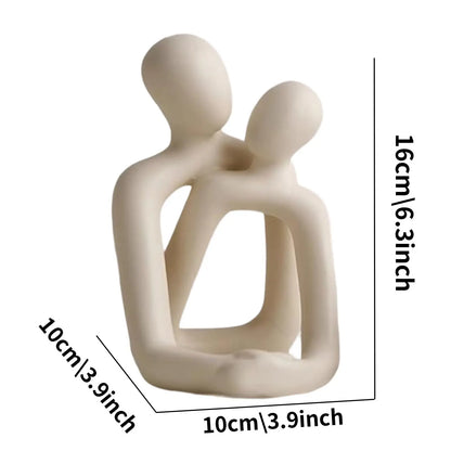 Beige abstract sculpture of two figures embracing with measurements on a white background