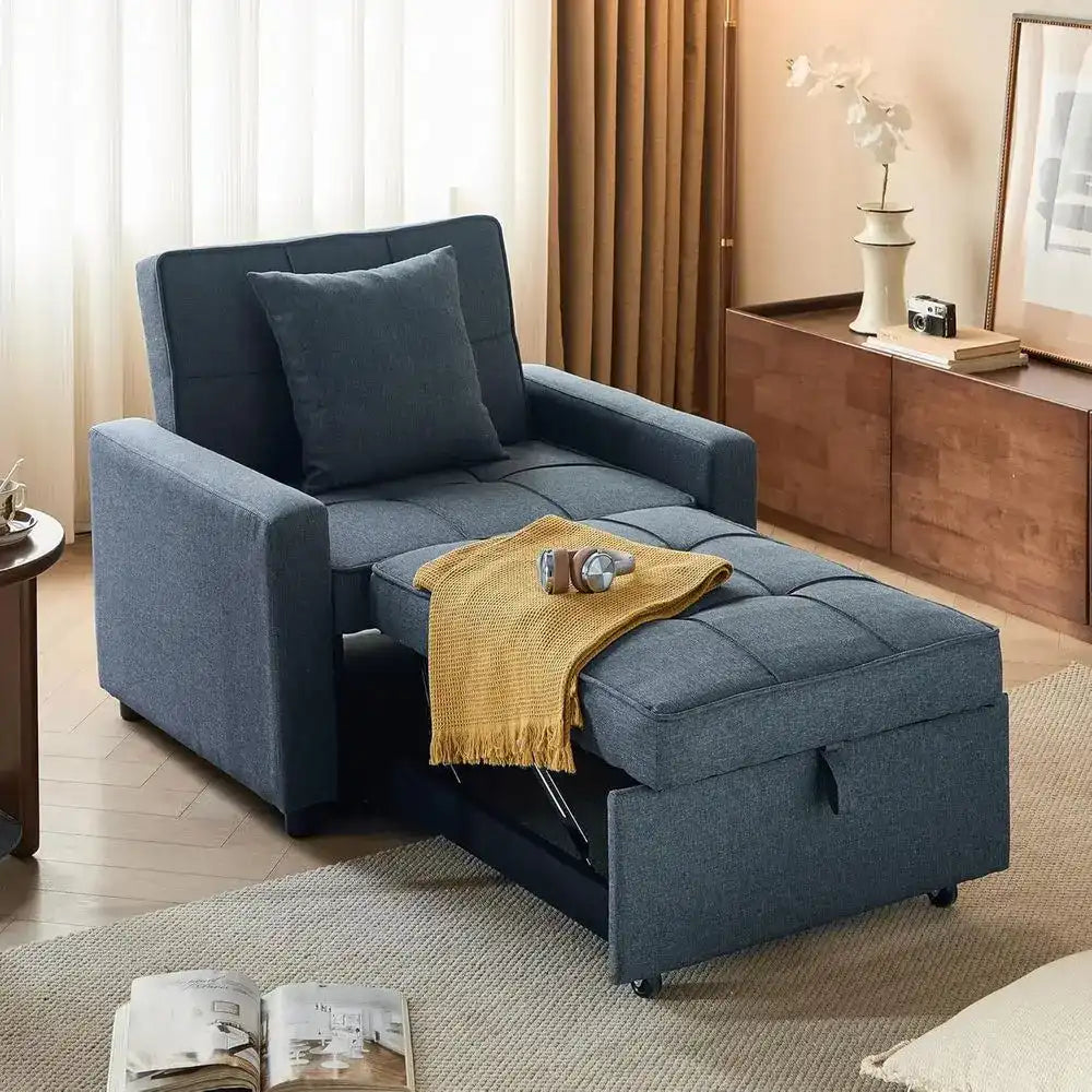 Blue sofa bed in a living room setting with a yellow blanket and a magazine.