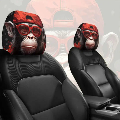 Car headrest covers with monkey design wearing red sunglasses on black car seats.