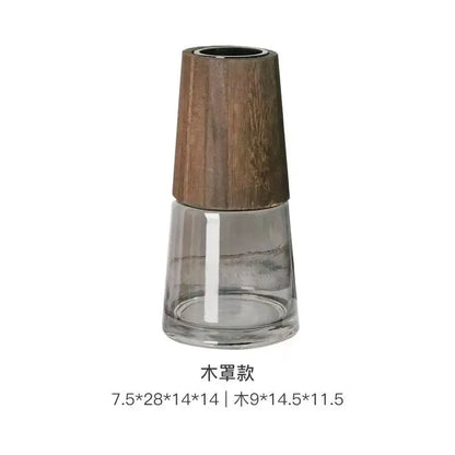Clear glass vase with wooden top on a white background
