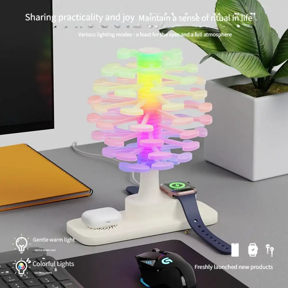 Colorful LED desk lamp on a desk with phone, watch, and computer mouse.