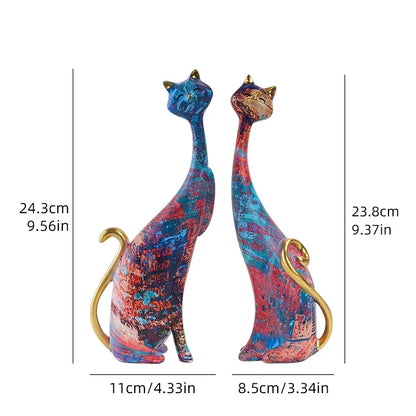 Colorful cat figurines with measurements on a white background