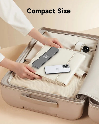 Compact suitcase with items being packed, emphasizing size.