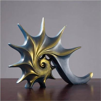 Decorative sculpture with gold and blue spiral design on a gray background