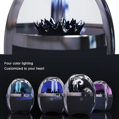 Decorative Bluetooth speaker with four color options displayed below it on a reflective surface.