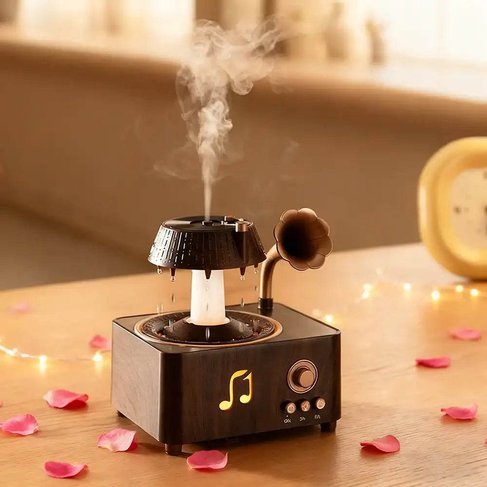 Decorative humidifier with steam emitting on a wooden surface with pink petals and string lights.