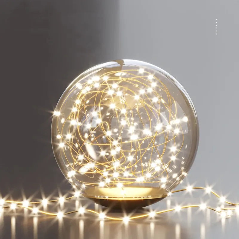 Decorative light bulb with string lights on a dark background