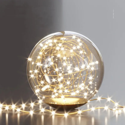 Decorative light bulb with string lights on a dark background