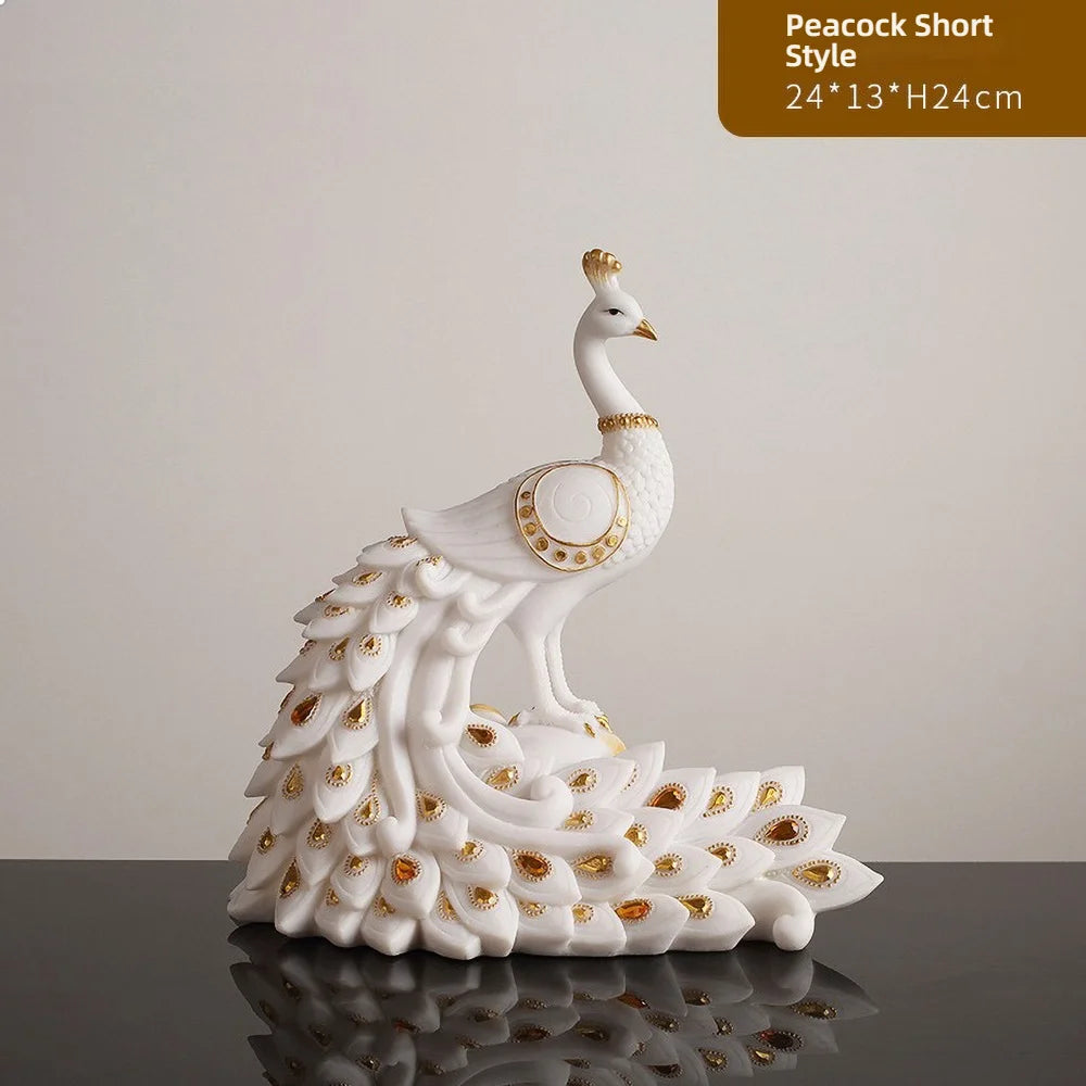 Decorative white peacock figurine with gold accents on a reflective surface.