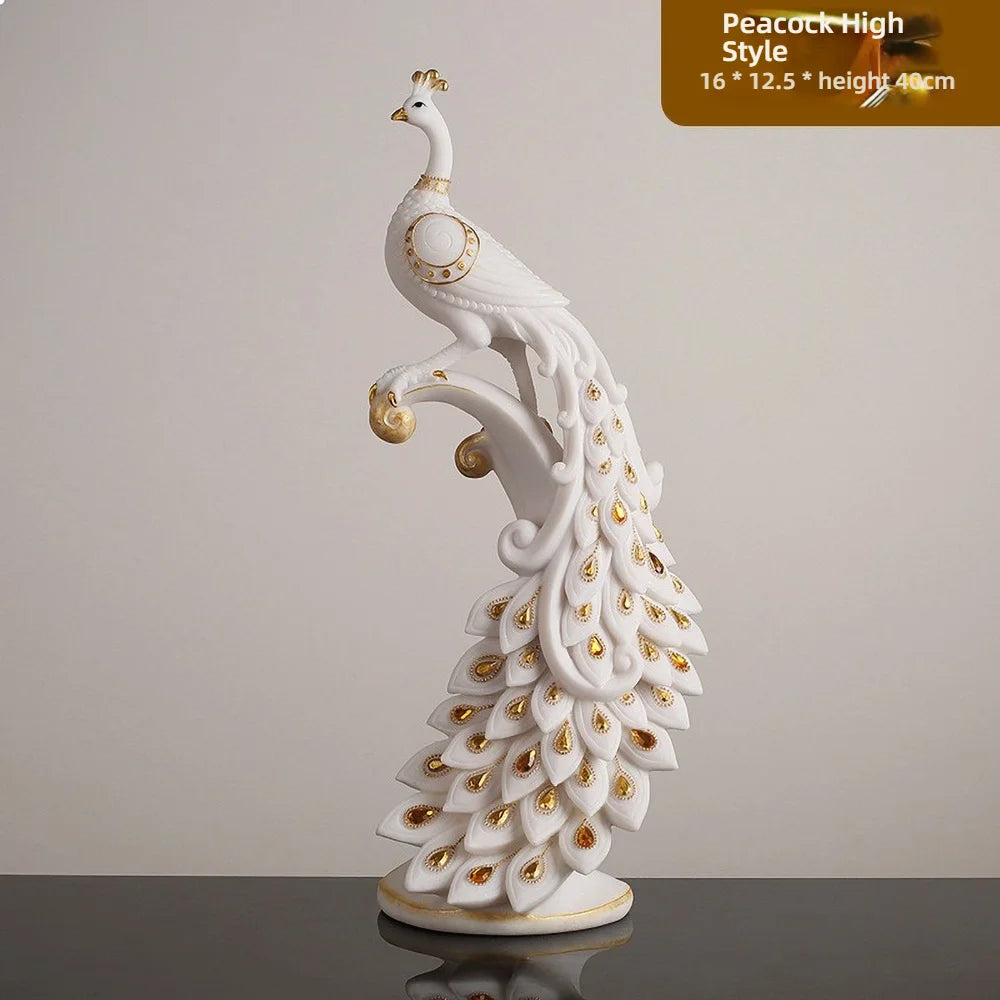 Decorative white peacock figurine with gold accents on a gray surface.