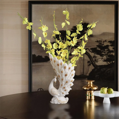 Decorative peacock vase with yellow flowers against a scenic painting background