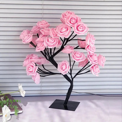 Decorative pink rose tree on a stand against a neutral background