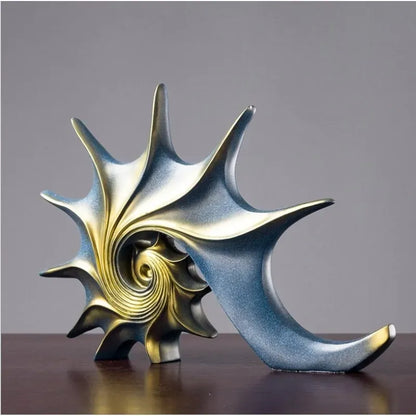 Decorative shell sculpture with a spiral design on a gray background