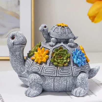 Decorative turtle figurine with plants on a surface