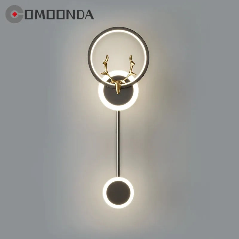 Decorative wall light fixture with deer antler design on a gray background, featuring the brand 'COMOONDA'.
