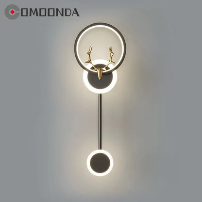 Decorative wall light fixture with deer antler design on a gray background, featuring the brand 'COMOONDA'.