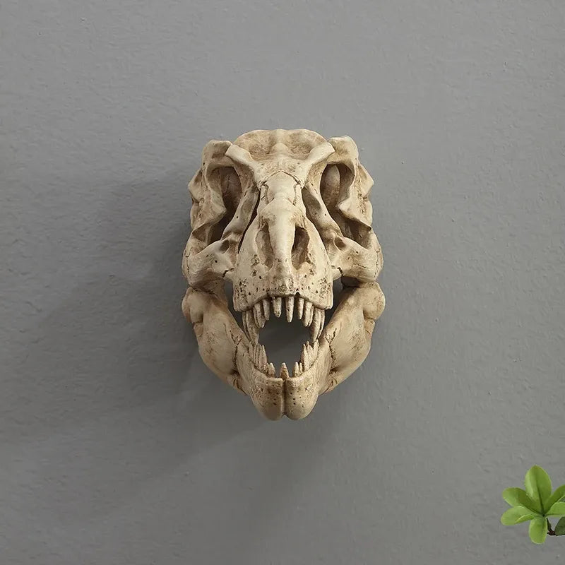 Decorative dinosaur skull on a gray wall with a plant in the corner
