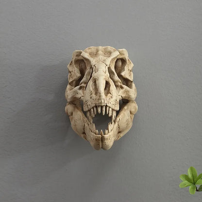 Decorative dinosaur skull on a gray wall with a plant in the corner