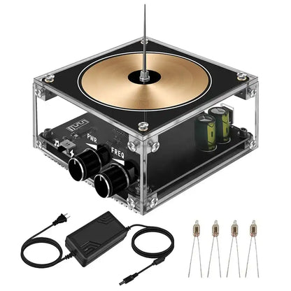 Electronic device with a metallic disc, control knobs, and cables on a white background