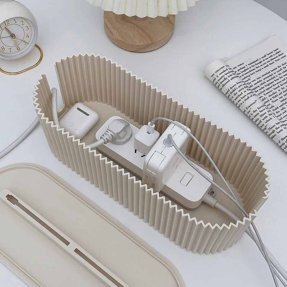 Foldable charging organizer with electronic devices on a white surface