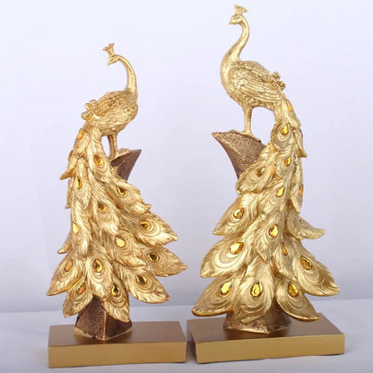 Gold peacock bookends on a light gray background