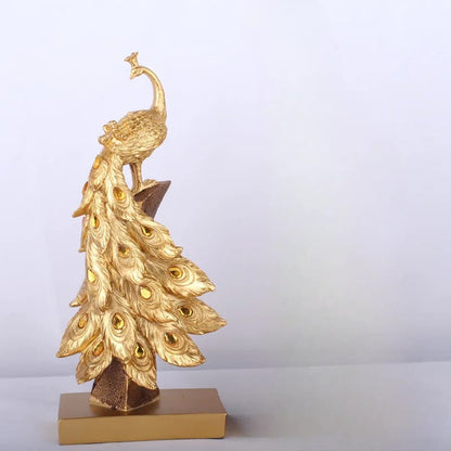 Gold peacock statue on a white background