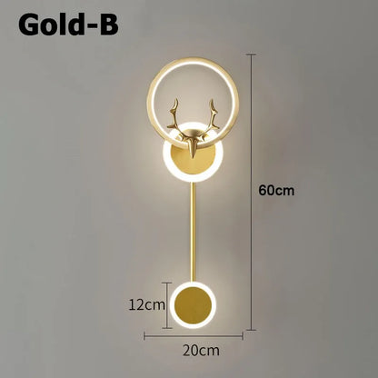 Gold wall lamp with deer head design and measurements on a gray background