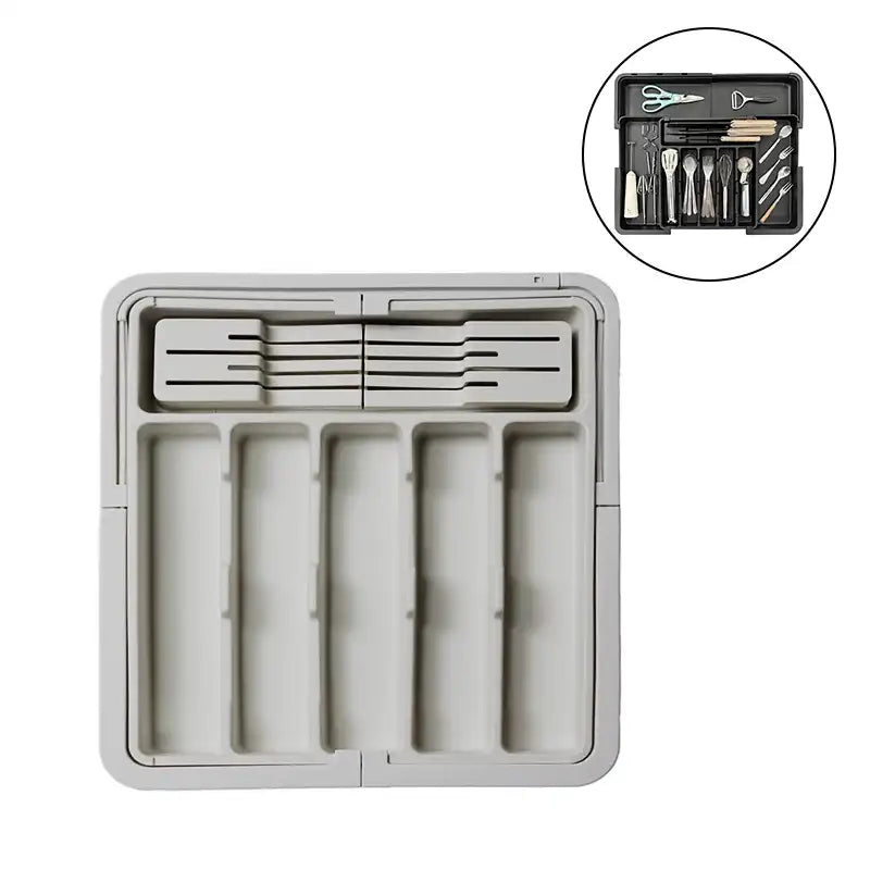Gray kitchen drawer organizer with tools on a white background