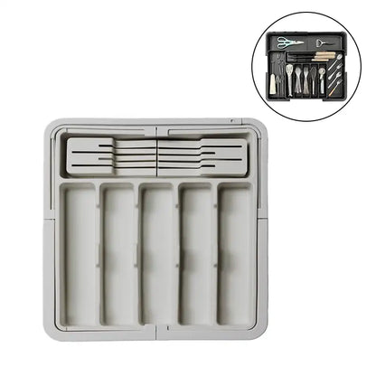 Gray kitchen drawer organizer with tools on a white background