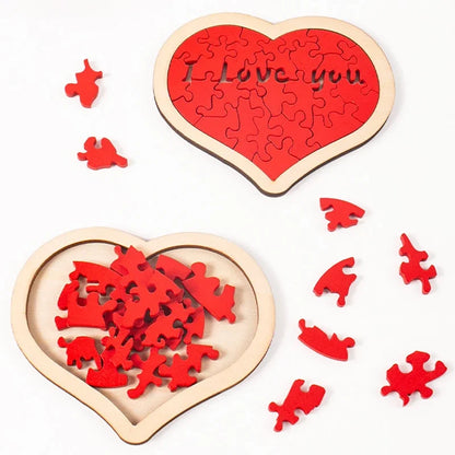 Heart-shaped wooden puzzle with red pieces and 'I Love You' text on a white background
