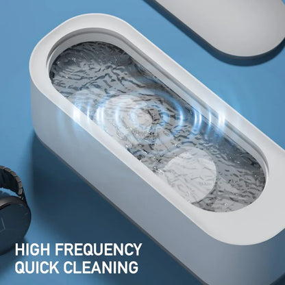 High-frequency cleaning device with water swirling inside, on a blue background.