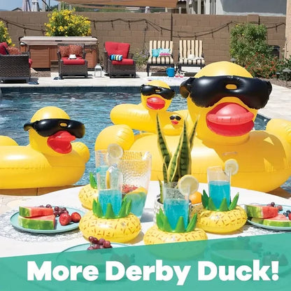 Inflatable rubber duckies with sunglasses and drinks by a poolside