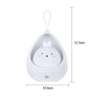 Small white animal-shaped container with a hanging loop, dimensions indicated.