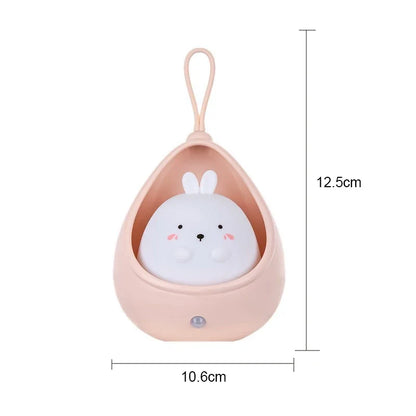 Small plush toy with a pink holder and dimensions indicated on a white background