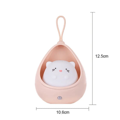 Small pink cat-shaped container with a white cat plush toy inside, on a white background.