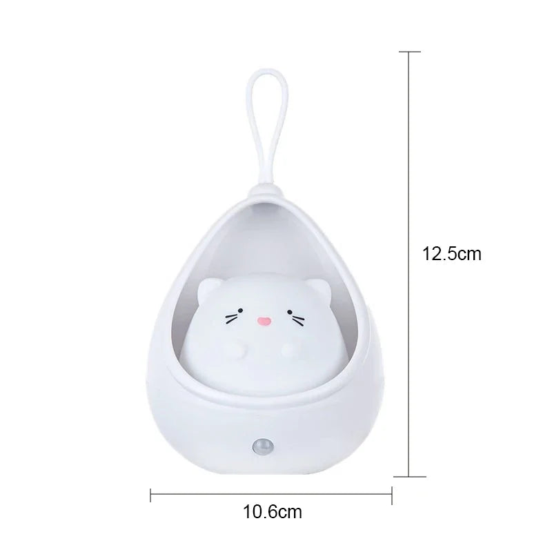 White hanging cat toy with a cat face design and dimensions on a white background