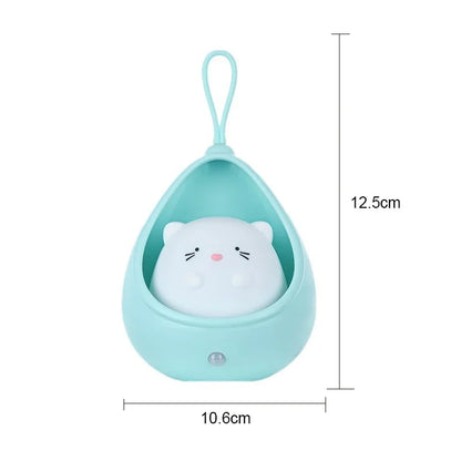 Small plush toy with a teardrop-shaped green container and dimensions indicated.