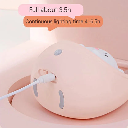 Pink electronic device with a cable, showing battery life information on a light pink background.
